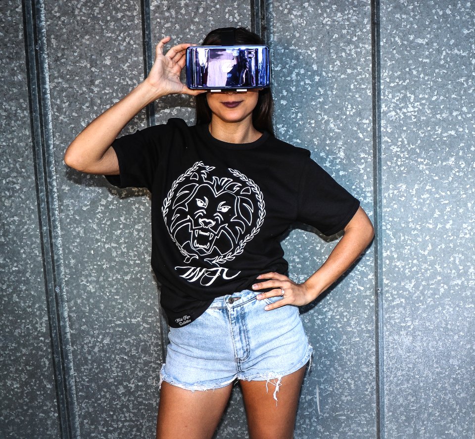 Woman Holding Virtual Reality Goggles On Her Face