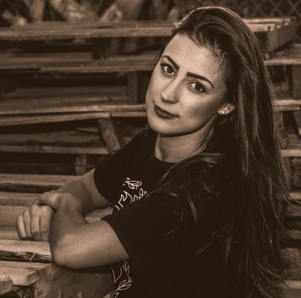 Woman Wearing Black Shirt Sitting photo