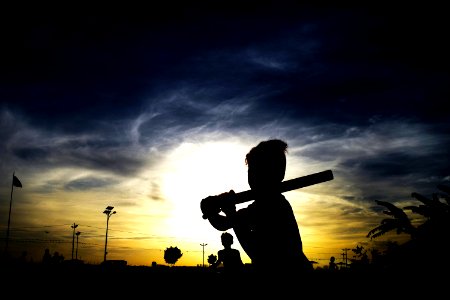 Silhouette Of Person Holding Stick photo