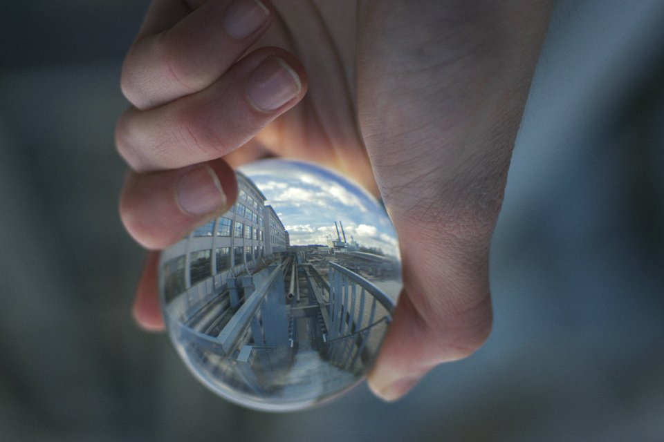Person Holding Clear Glass Decor