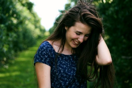 Photo Of A Woman Holding Her Hair photo