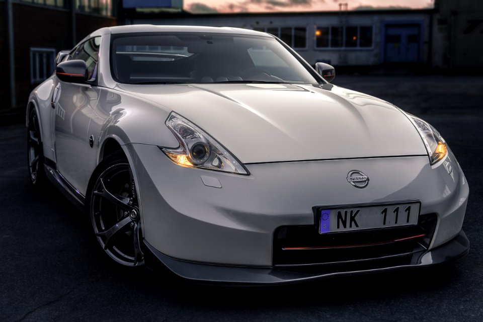 Photo Of White Nissan Car