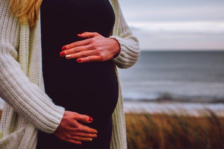 Woman Pregnant Standing Near Beach photo