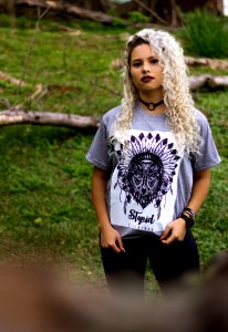Woman Wearing Gray And Black Tribal Graphic Crew-neck Shirt And Black Pants