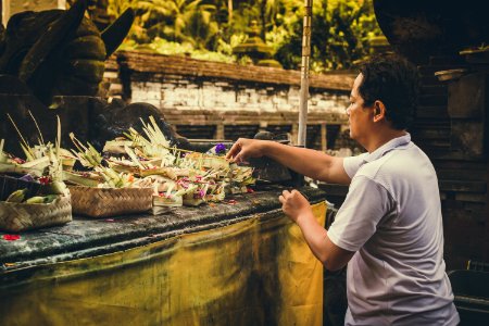 Man Fixing Flower Arrangements photo