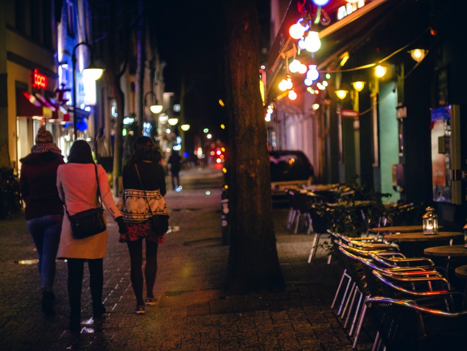 Three Women Walking During Nightime