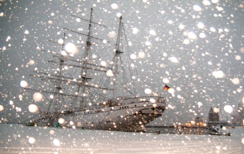 White Sailing Ship Docked At Pier
