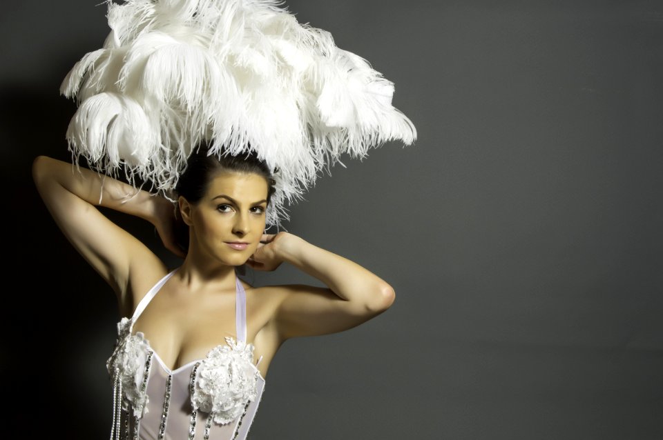 Woman In White Headdress And White Mesh Top
