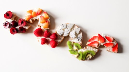 Assorted Sliced Fruit Lot On White Surface photo