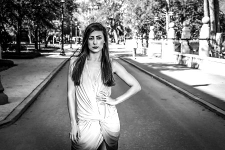 Woman Wearing Dress Standing On Grey Concrete Road photo