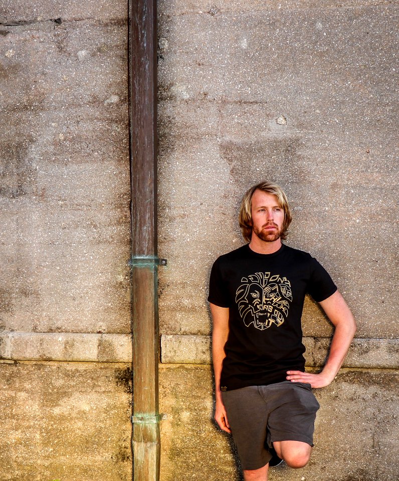 Man In Black Shirt And Bermuda Shorts