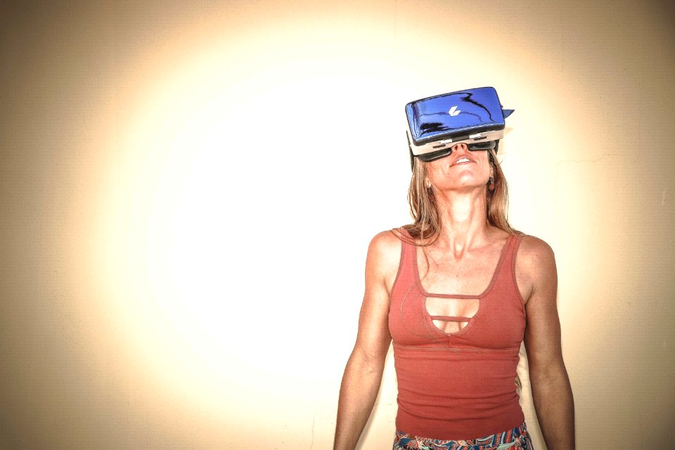 Woman In Brown Cages Sleeveless Top And Blue Virtual Reality Headset