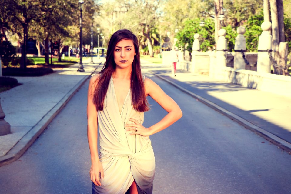 Woman In Gray Sleeveless Mini Dress Standing On Pavements
