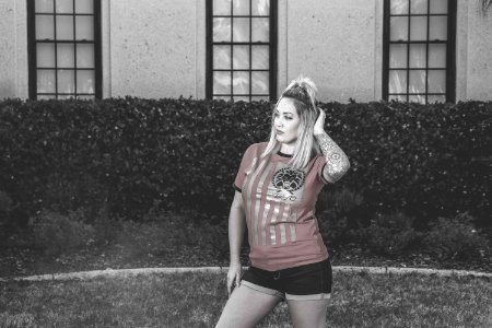Woman Wearing Red Crew-neck Shirt With Black Short Shorts