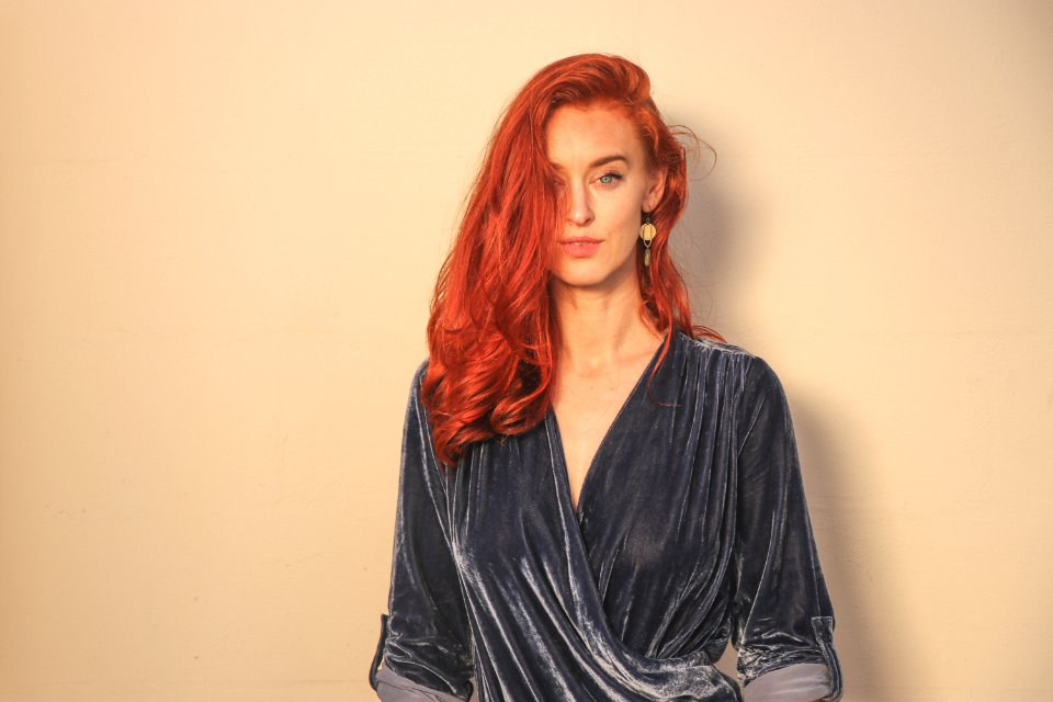 Woman In Gray Surplice Top Standing