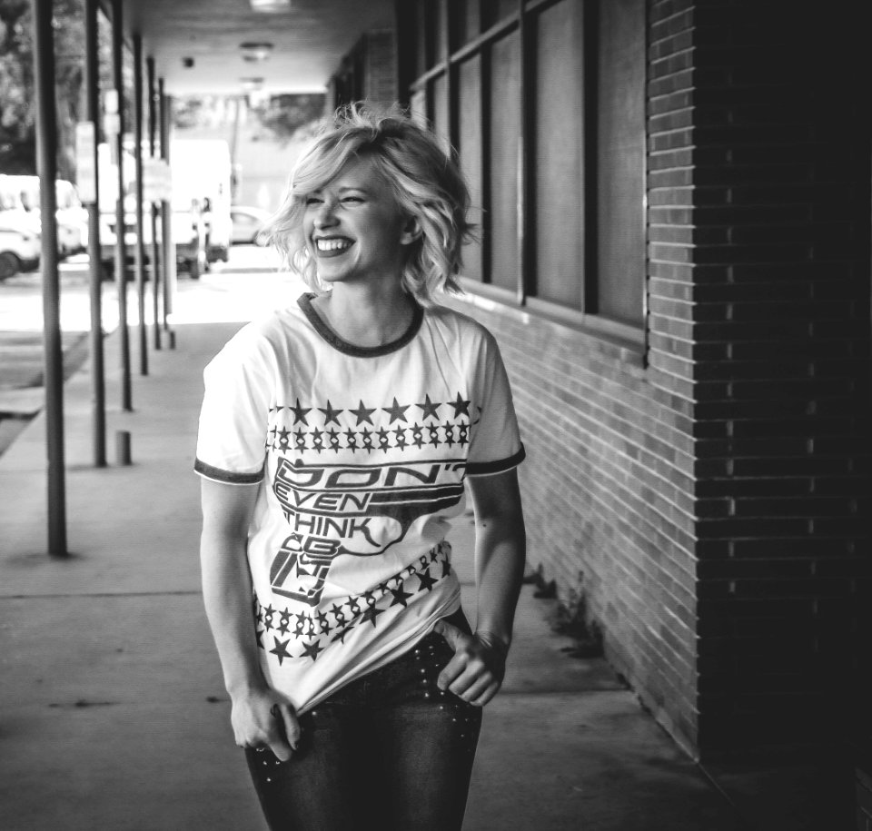 Woman Wearing White Crew-neck Shirt And Denim Jeans