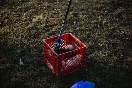 Baseball Bat And Baseball Inside Red Crate