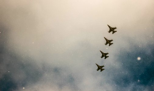 Four Gray Jet Planes On Sky photo
