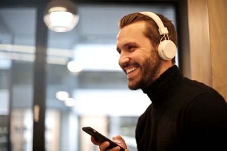 Man Wearing White Headphones Listening To Music