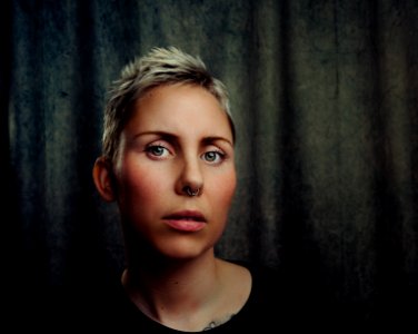 Woman With Silver-colored Septum Piercing photo