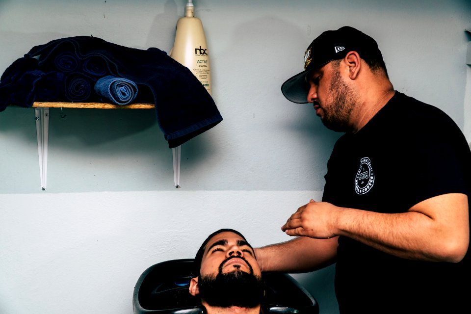 Man In Black Shirt Staring At Man