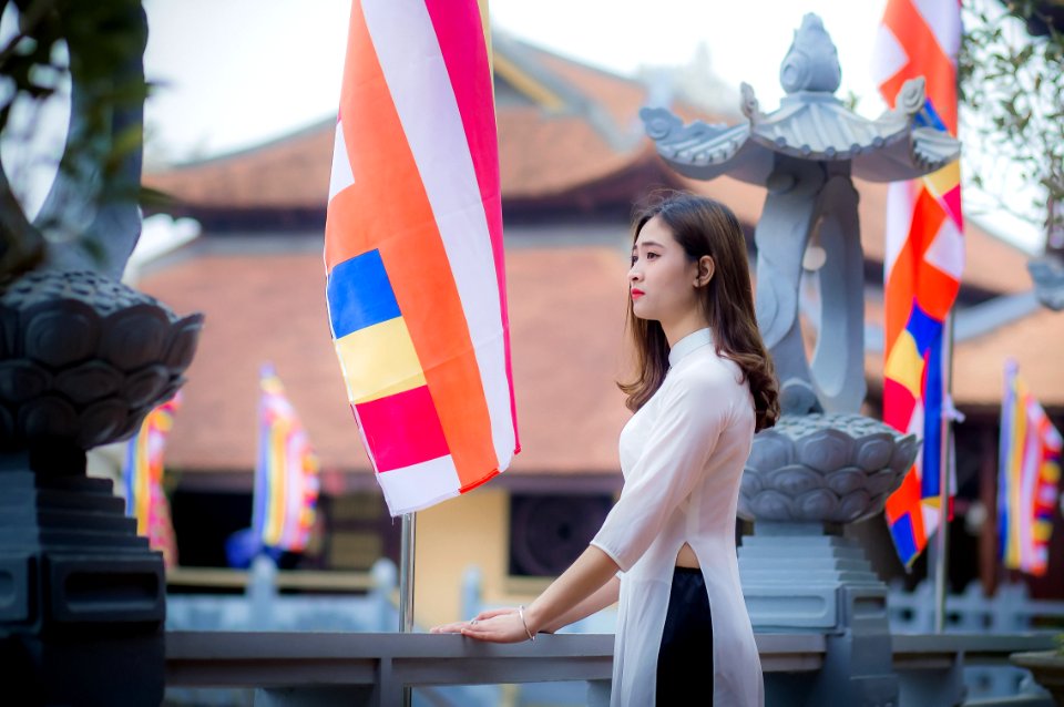 Woman Standing In Front Of Banner photo