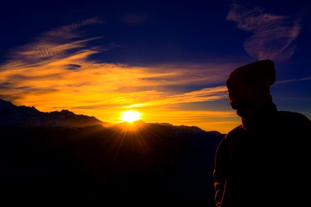 Silhouette Of Person Near Mountain During Golden Hour photo