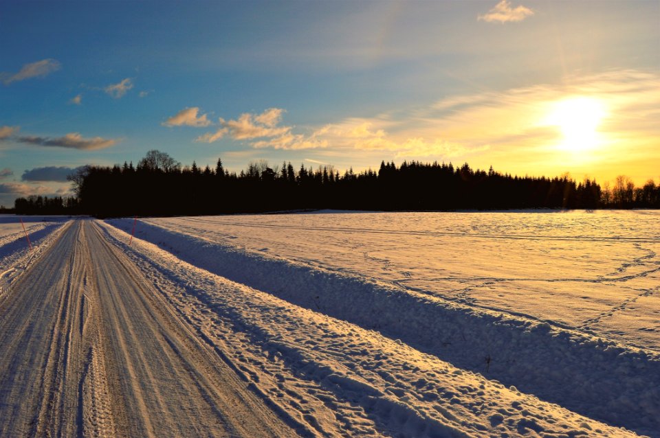 Snow Covered Road During Golden Hour