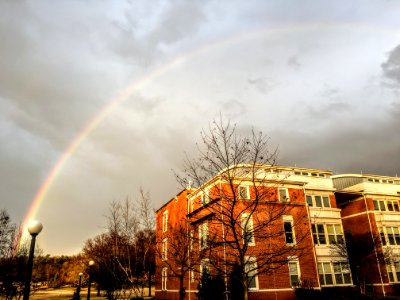 Rainbow Appear Above Brown And White Concrete Building photo