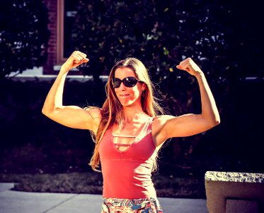 Woman Showing Muscles