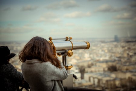 Person Using Telescope