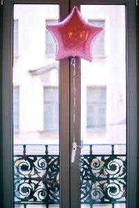 Photo Of Pink Star Balloon Hang Beside Door