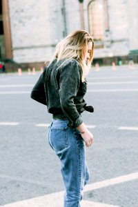 Photo Of Woman Wearing Black Denim Jacket And Blue Jeans photo