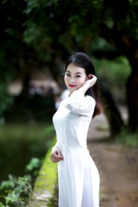 Woman Wearing White 34-sleeved Dress