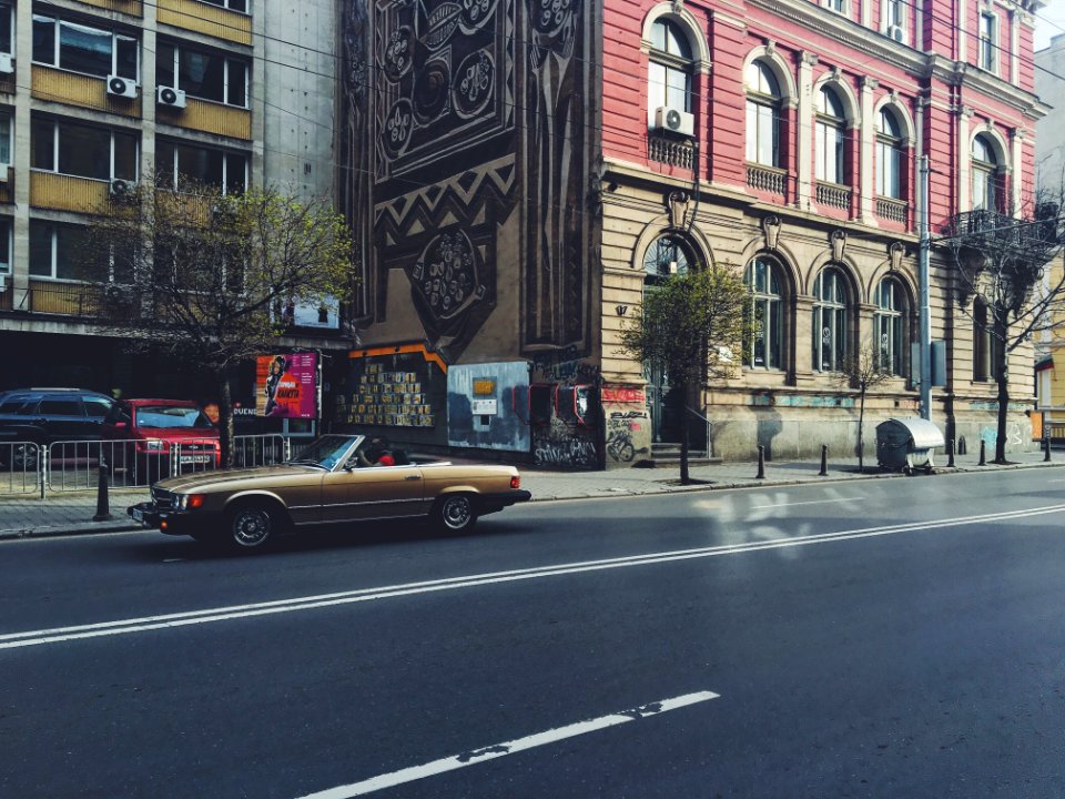 Photo Of Brown Convertible Coupe On The Road