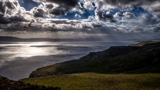 Photo Of Ocean Under Cloudy Sky
