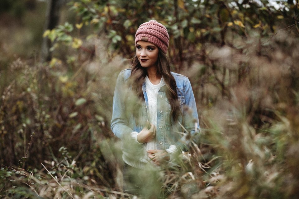 Woman Wearing Denim Jacket Near Trees And Bush
