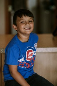 Person Taking Photo Of Boy In Blue Chicago Cubs Crew-neck T-shirt In Tilt Shift Photography photo