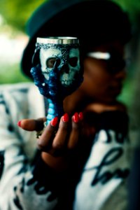Person Holding Skull And Bird Claw Goblet