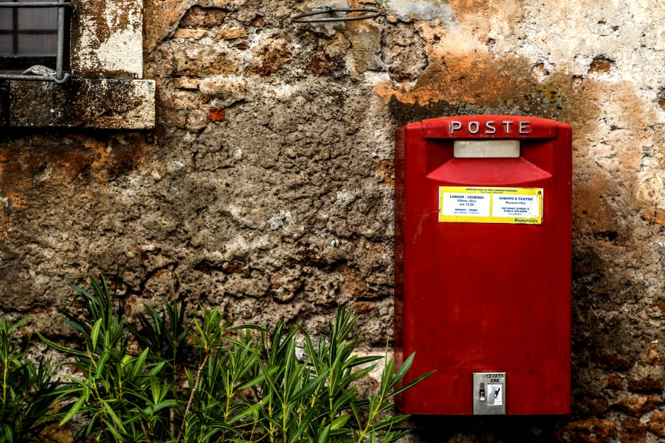Red Mail Box Beside Green Grass