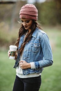 Woman Wearing Blue Denim Jacket And Pink Knit Cap Holding Starbucks Coffee photo