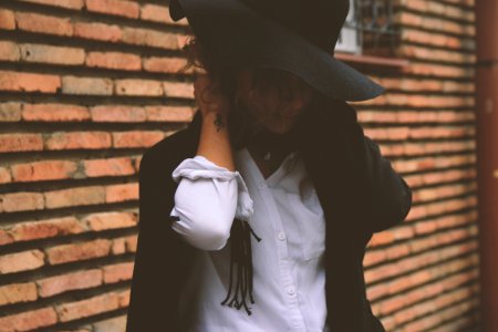 Woman Wearing White Dress Shirt And Black Coat photo