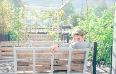 Man In Gray Shirt Sitting On Bench