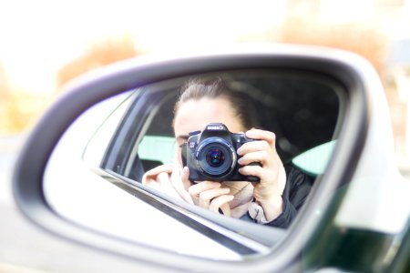 Close-up Photography Of Woman Taking A Photo photo