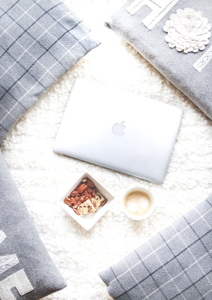 Flatlay Photography Of Macbook And Snacks