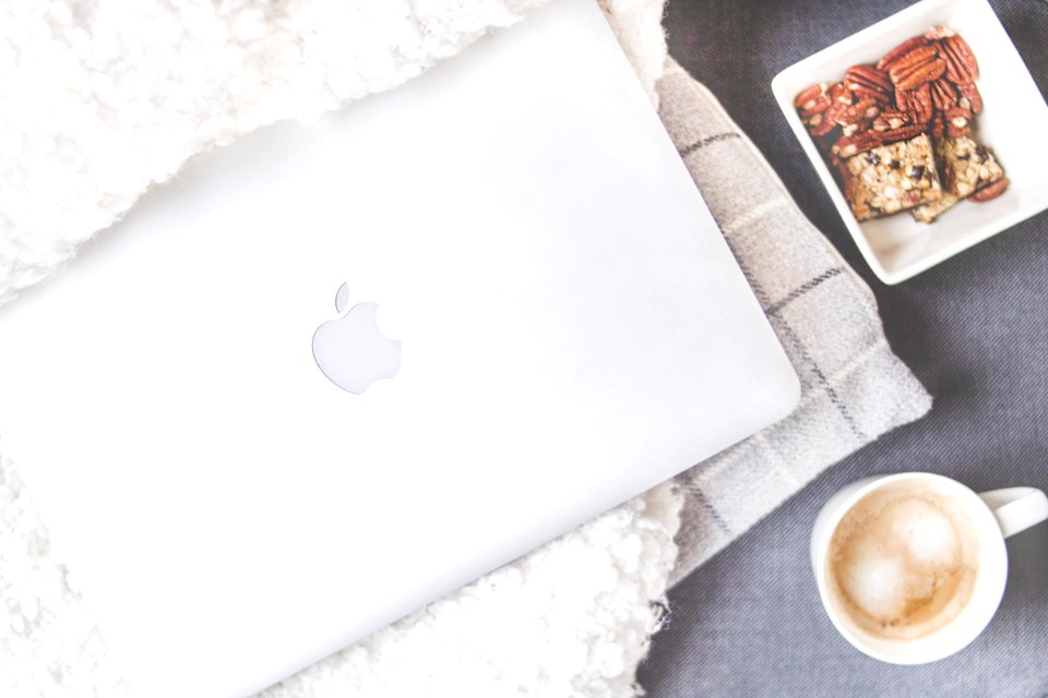 Flatlay Photography Of Macbook And Snacks
