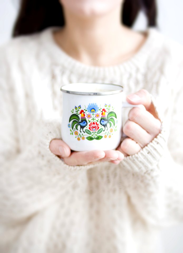 Photo Of A Person Holding A Cup