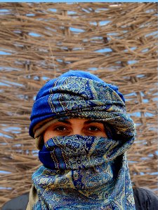 Person Wearing Blue And Brown Hijab Veil