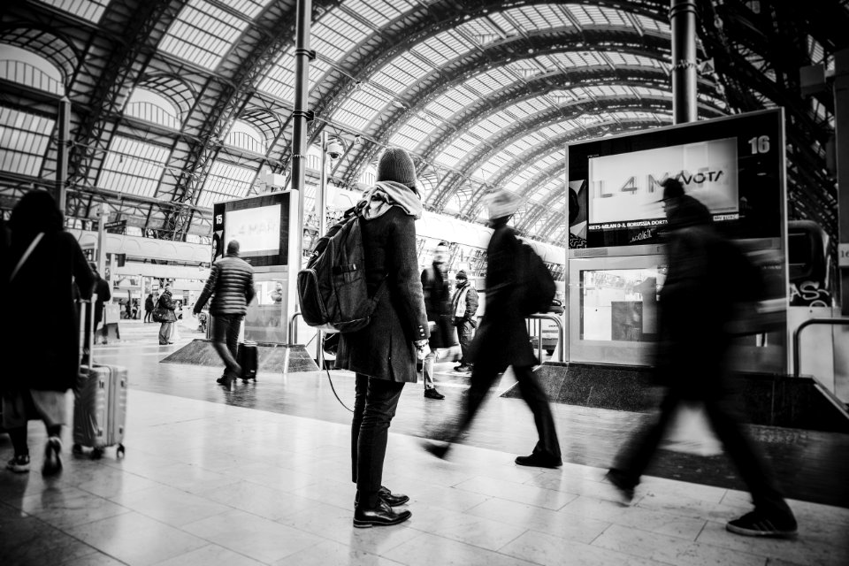 Time Lapse Grayscale Photograph Of People Pass Through Inside Transportation Terminal