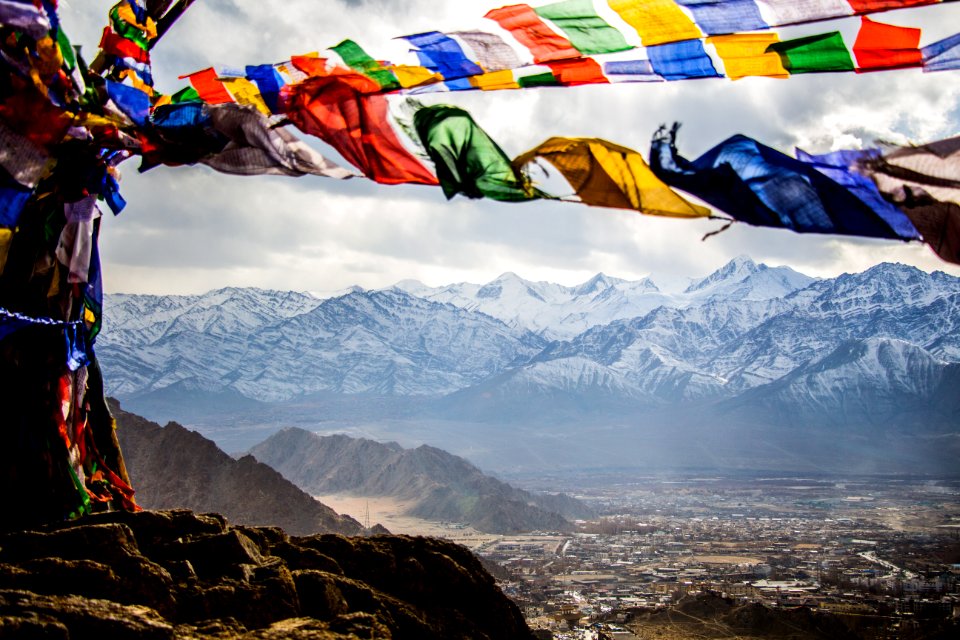 Assorted-color Banners On Mountain